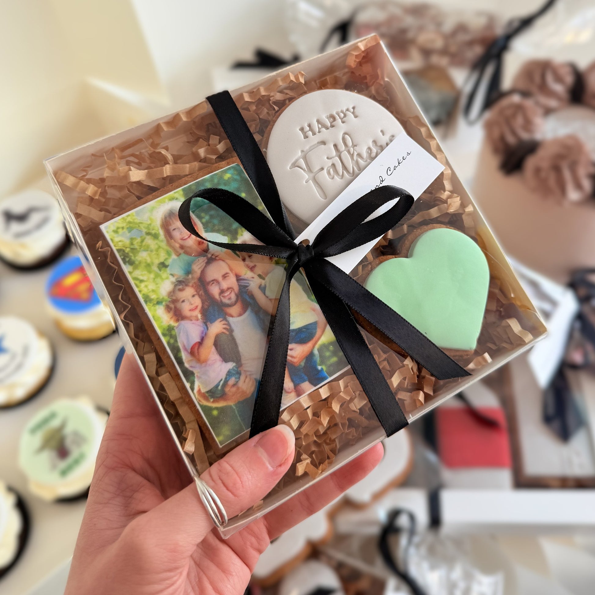 Father's Day custom image gift box with a photo printed on gingerbread, a Happy Father's Day cookie and a green fondant heart, tied with black ribbon
